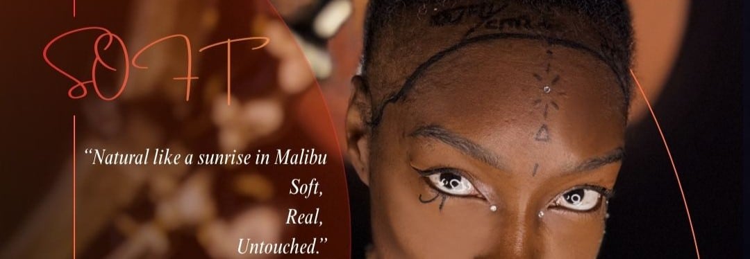 A woman with a natural, precisely outlined hairline looks directly at the camera in a warm, elegant setting. The marked hairline emphasizes soft, realistic hair restoration results.